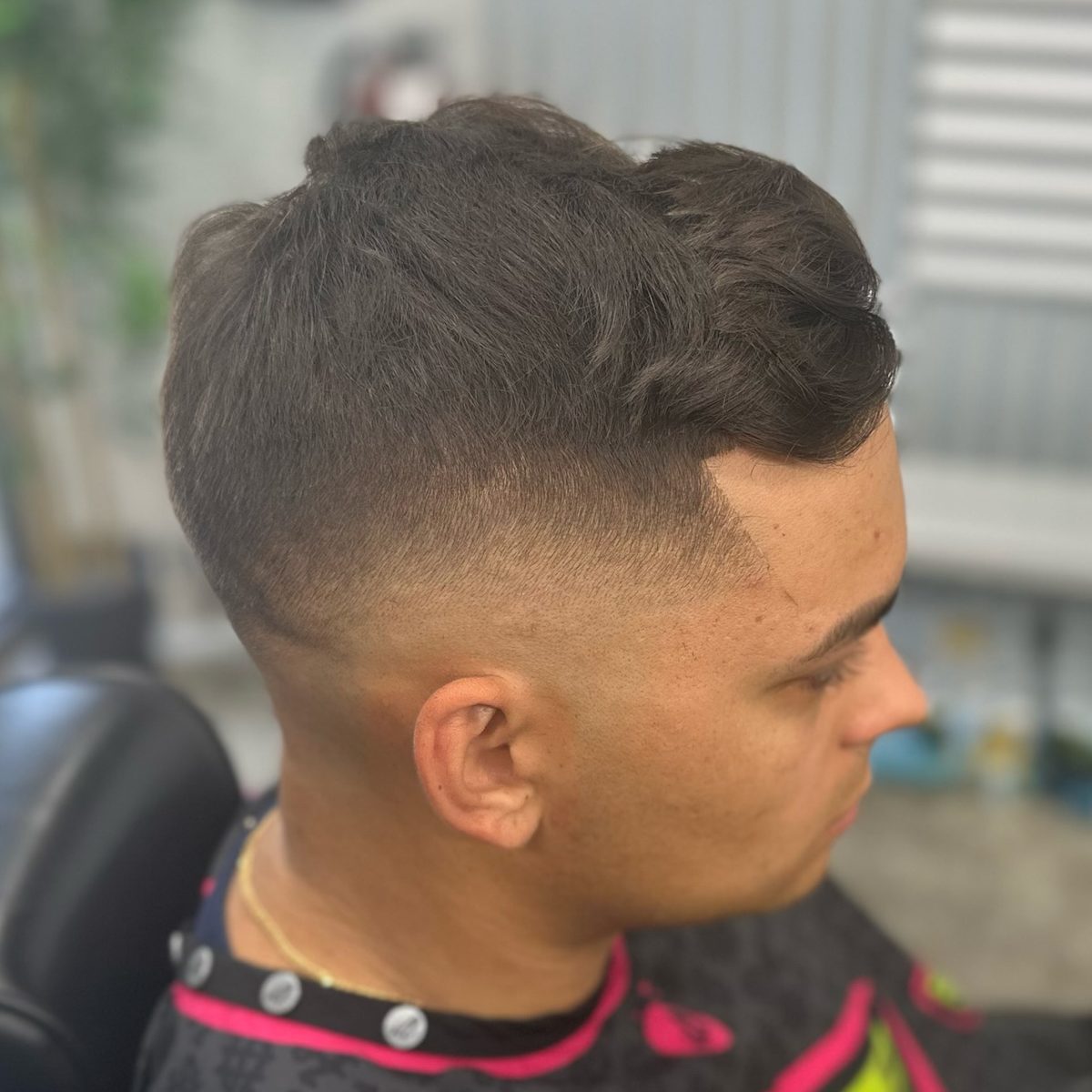 Client showing a fresh, clean skin fade haircut at Cuts4Sale Barbershop